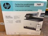 the box of the printer is open on the floor