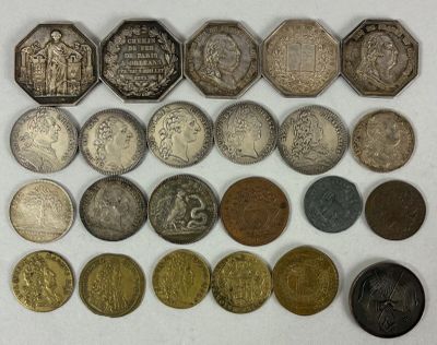 an image of a collection of old coins on a white surface