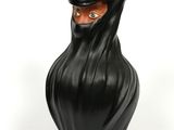 a black vase that has a face on it
