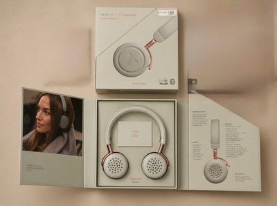 packaging of a pair of headphones with a picture of a woman in the background