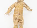 an image of a wooden doll is standing on a white surface