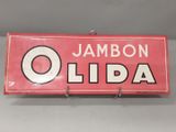 un gros plan d'une enseigne sur laquelle on peut lire « jambon olida »