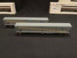 three model train cars sitting on top of a table next to each other