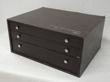 a small black box with four drawers on it