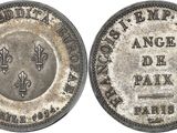 an old silver coin with a fleur de paix on it