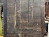 an old wooden door in a room that is being worked on