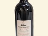 a bottle of wine that is sitting on a table