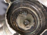 a close up of a metal object with a hole in it