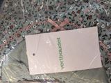 a picture of a bag of clothing that is wrapped in plastic