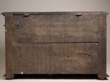 an old wooden chest sitting on top of a white floor