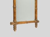 a mirror that has a wooden frame on it