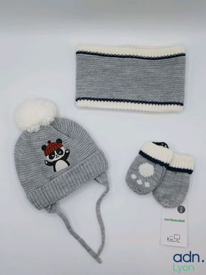 grey and white knitted hat, mittens, and hat with a bow
