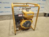 a close up of a small engine on a stand in front of a sign