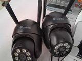 two cameras that are sitting next to each other on a table