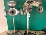 two hair dryers that are sitting on the floor