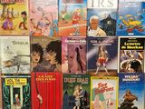 a lot of books that are sitting on a shelf