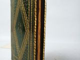 a book that is sitting on a white surface