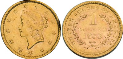 a gold coin with a woman ' s head on it