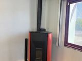 a wood burning stove in the corner of a room