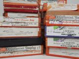 many books stacked on top of each other on a table