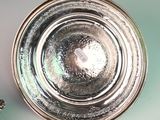 a silver plate that is sitting on a table