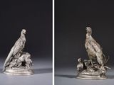 two images of a silver statue of a bird and a bird on a rock