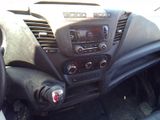 a dashboard of a car with a radio and a steering wheel
