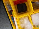 a plastic container with many different items in it