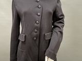 an image of a mannequin dressed in a black suit and hat