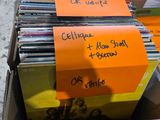 a cardboard box full of cds and cds on the street