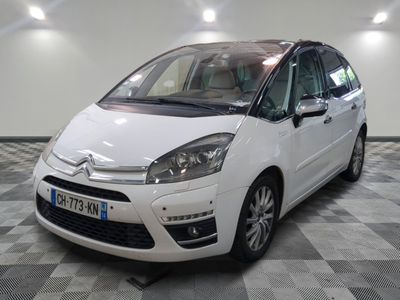 a picture of a white citrole parked in a garage