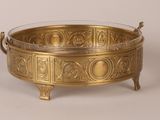 an antique brass bowl with handles and handles on a stand