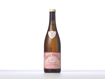 a close up of a bottle of wine on a table