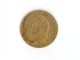 a gold coin with a picture of a woman on it