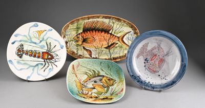 several plates with different designs on them on a gray surface