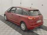 an image of a red car parked in a garage