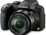 a black camera with a lens attached to it