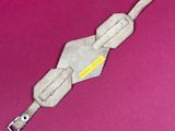 an image of a toy gun on a pink surface