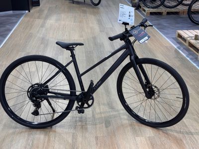 a black bicycle that is on display in a store