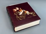 an old book with a picture of a man and a woman on it
