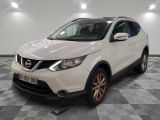 the white nissan qx - v is parked on a checkered floor
