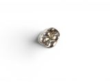 a close up of a diamond on a white surface