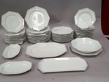 a lot of plates that are sitting on a table