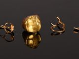a lot of gold spoons that are in the water