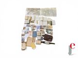 a lot of old papers and other things on the table