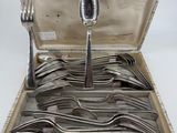 silverware in a silver case with spoons and forks in it