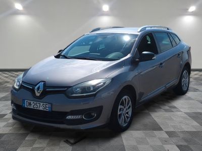 the grey car is parked on a checkered floor in a room