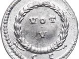 a close up of a silver coin with a wreath on it