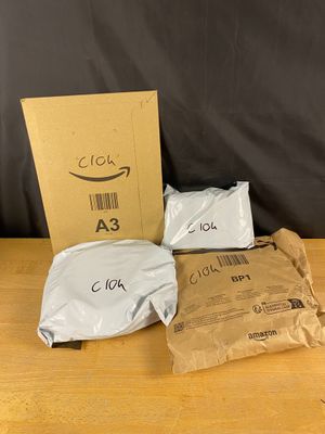 a box of amazon products sitting on top of a wooden table