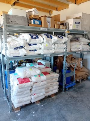 a lot of bags on the shelves in the warehouse